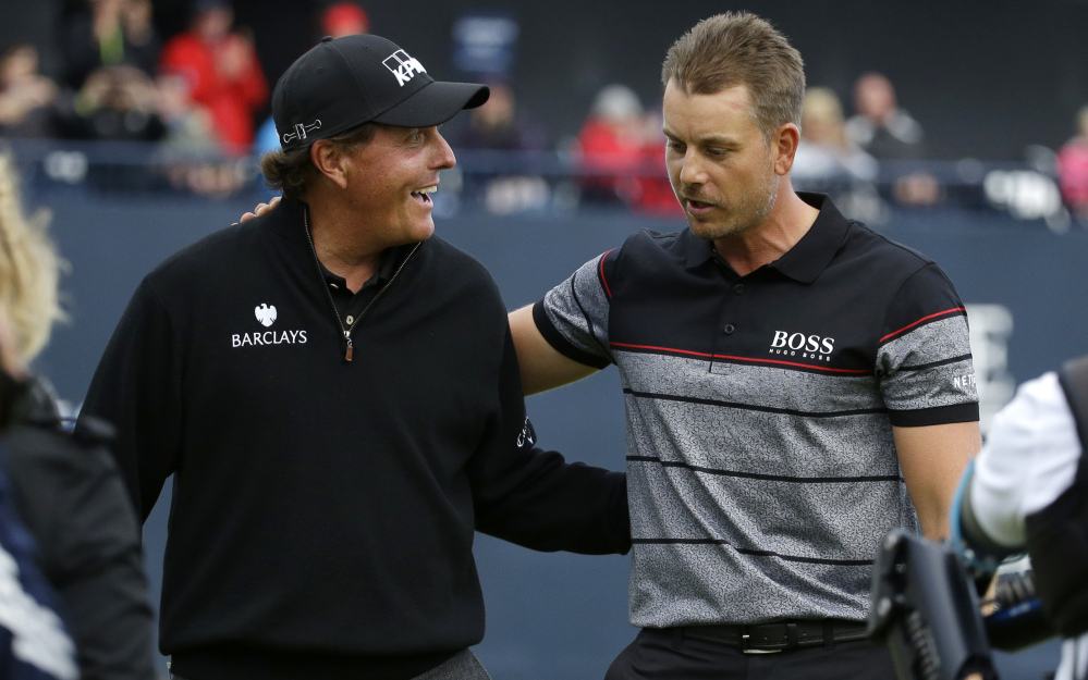 Phil Mickelson, left, and Henrik Stenson staged a memorable duel in the British Open last year. This year's U.S. Open course has elements of a British links, but figures to prove much tougher with tall grass off the fairways and ill-maintained bunkers.