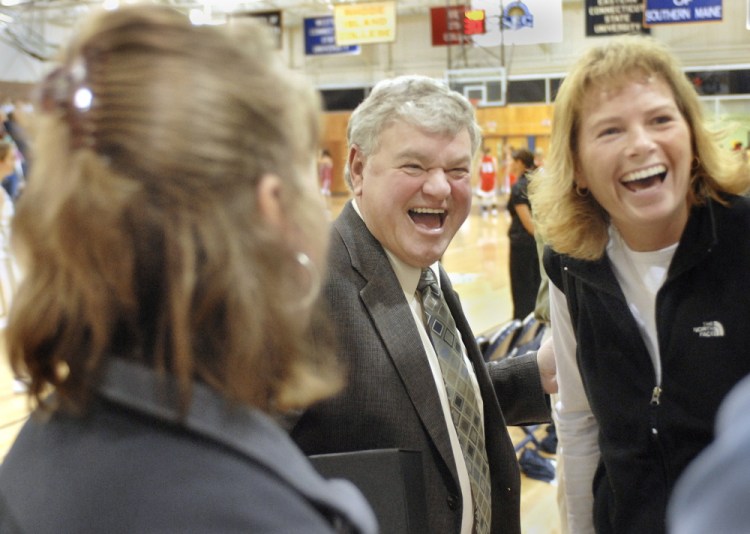 Gary Fifield laughs with former players during a ceremony honoring him at the University of Southern Maine in 2015. 