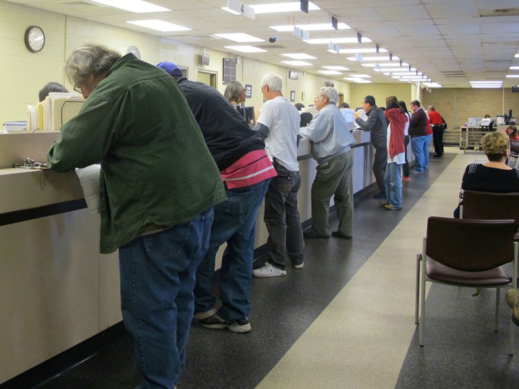 Motorists visit a South Carolina Department of Motor Vehicles office during a program that allowed some people with suspended licenses to get them reinstated. Many states have opted out of a federal law that calls for stripping drug offenders' licenses; the governor of Maine, Paul LePage, would like the state to sign on to the federal statute.