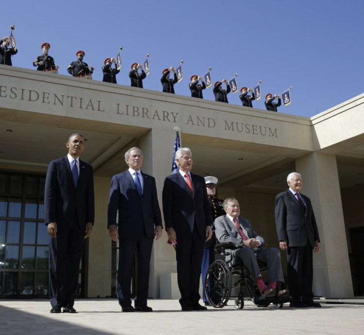 President Barack Obama and former presidents George W. Bush, Bill Clinton, George H.W. Bush and Jimmy Carter arrive for the 2013 dedication of the George W. Bush Presidential Center. Presidential libraries cost U.S. taxpayers $66 million a year.
