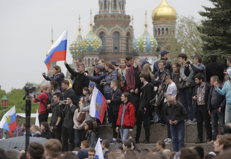 People gather for an anti-corruption rally in St. Petersburg, Russia.The protest gatherings in cities from Far East Pacific ports to St. Petersburg were spearheaded by Alexei Navalny, the anti-corruption campaigner.