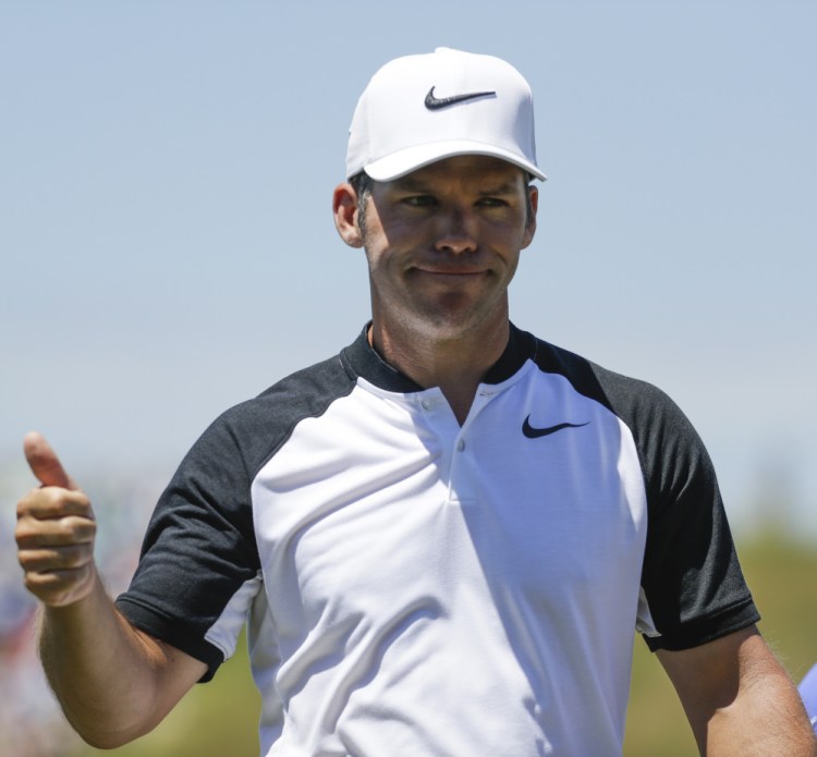 Paul Casey gives a thumbs up on the ninth hole during the second round of the U.S. Open. Casey overcame a triple bogey and was in a four-way tie for the lead at 7 under.
