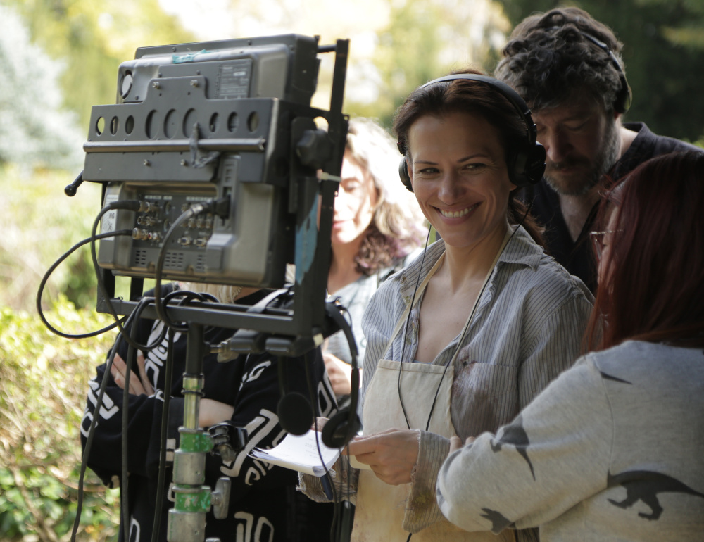 Catherine Eaton, in headphones, directs "The Sounding," a mystery that was filmed partly on Monhegan Island. Eaton also co-wrote and acted in the movie, which will open the Maine International Film Festival July 14 in Waterville. The 10-day festival features more than 100 American and foreign films.