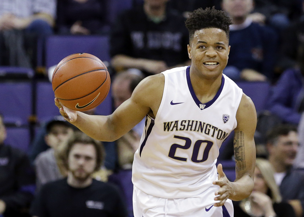 Markelle Fultz, the Washington guard expected to be the top overall pick in Thursday's NBA draft, works out for Philadelphia on Saturday as rumors regarding a trade of the pick between the 76ers and Boston Celtics picked up steam. (Associated Press/Elaine Thompson)