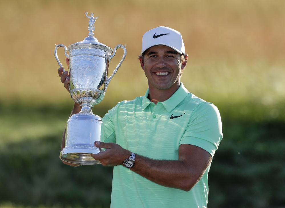 Brooks Koepka poses with the championship trophy after winning the U.S. Open on Sunday in Erin, Wis. 