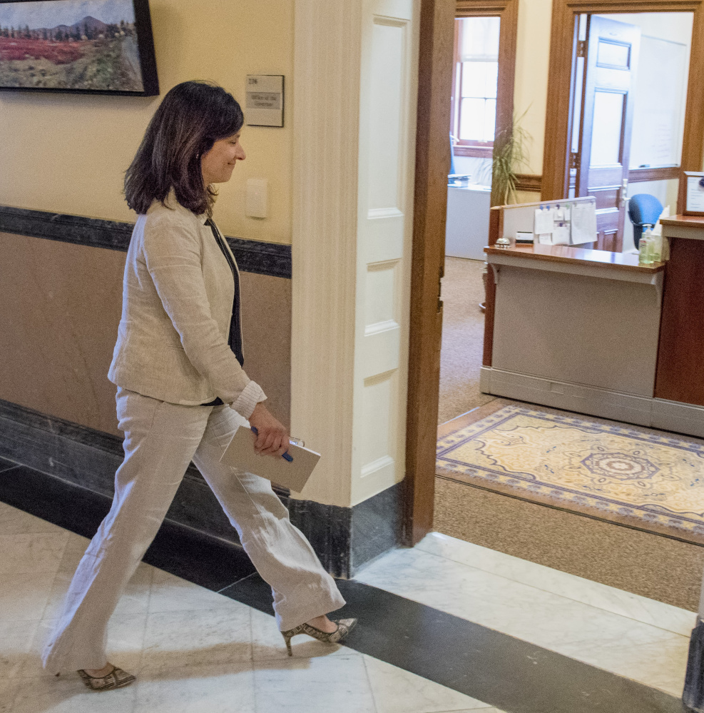 House Speaker Sara Gideon enters Gov. LePage's office for a meeting on the budget impasse Tuesday. They spoke privately for about 45 minutes. Asked afterward how far apart the sides are, Gideon replied, "The same."