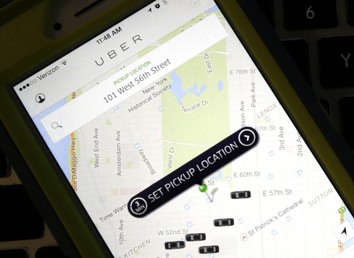 A smartphone displays Uber car availability in New York. Uber is catching up to its rival Lyft by enabling riders to tip its U.S. drivers with a tap on its ride-hailing app.