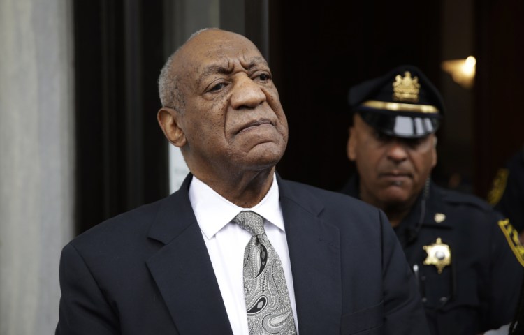 Bill Cosby exits the Montgomery County Courthouse after a mistrial was declared in his sexual assault trial in Norristown, Pa.