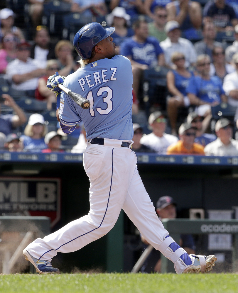 The Royals' Salvador Perez watches his grand slam in the eighth inning Wednesday. The home run, Perez's first career grand slam, gave Kansas City a 6-4 win over the Red Sox.