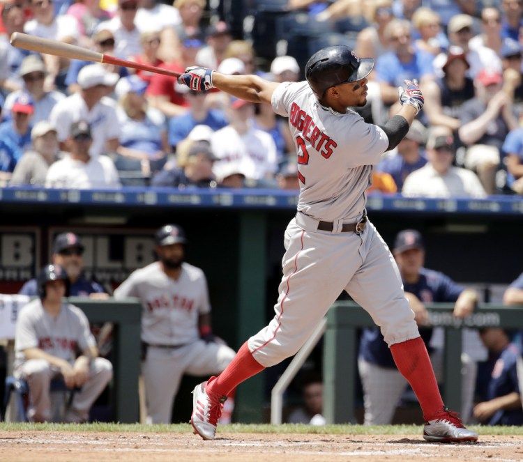 Xander Bogaerts hits a solo home run in the fourth inning. It was the second of back-to-back home runs for the Red Sox, following a blast by Andrew Benintendi.