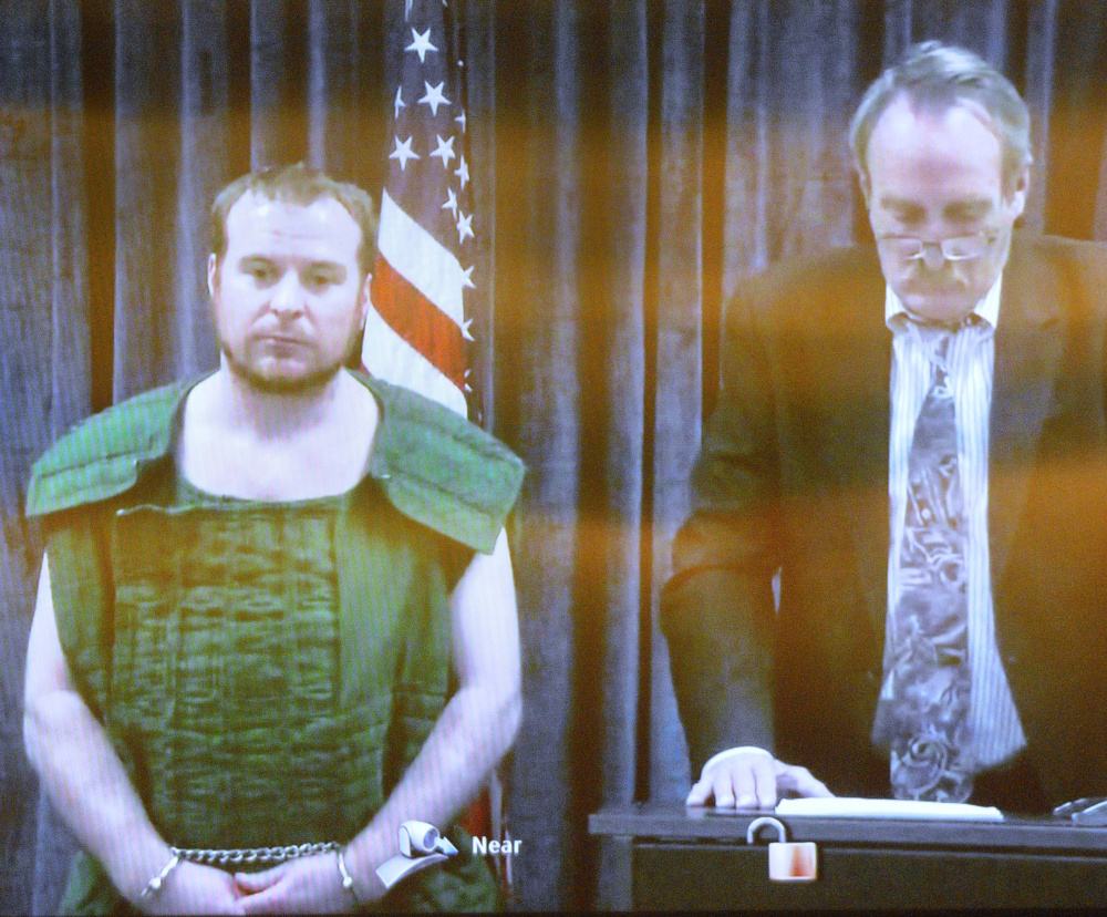 Jeremy Clement and his attorney, Steve Bourget, appear on video from the Kennebec County Jail during his initial appearance April 21 in the Capital Judicial Center in Augusta.