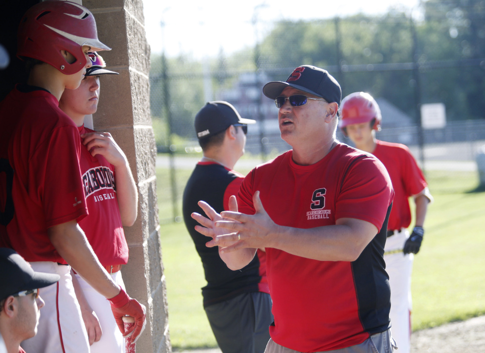 Scarborough Coach Mike D'Andrea talks to his players between innings on Wednesday. D'Andrea says the new league gives players more flexibility to attend weekend tournaments.