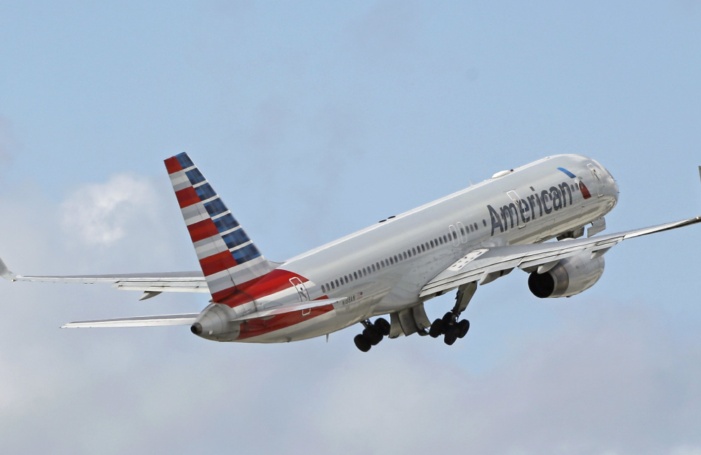 American Airlines passenger jet takes off from Miami International Airport in Miami on June 3. American said in a regulatory filing Thursday that Qatar Airlines' bid to buy shares in the American carrier was unsolicited, but that there have been conversations between the CEOs of both airlines.