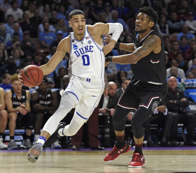 Duke's Jayson Tatum, left, was drafted Thursday night by the Boston Celtics with the No. 3 overall pick in the NBA draft. (Associated Press/Rainier Ehrhardt, File)