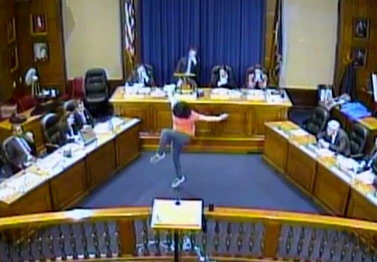 Sara Juli performs her unusual interpretive dance to open a meeting of the Portland City Council in March.