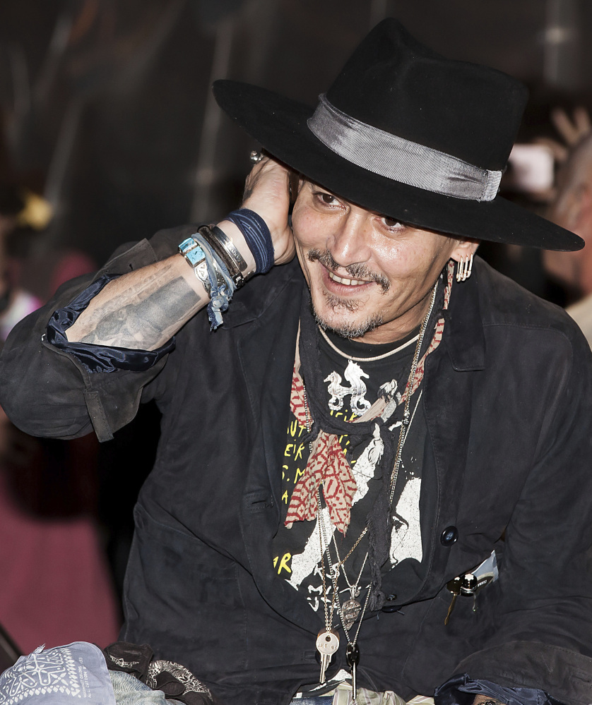 Actor Johnny Depp arrives at the Glastonbury music festival on Thursday.