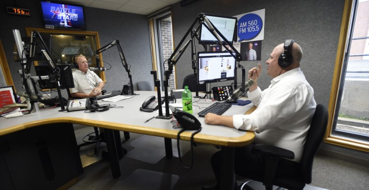 WGAN's "Morning News" hosts Ken Altshuler, left and Matt Gagnon spar on the air Friday in the station's South Portland studio. The political discourse on the show, punctuated with sound effects and banter about pop culture, has alienated some longtime listeners of the broadcast.