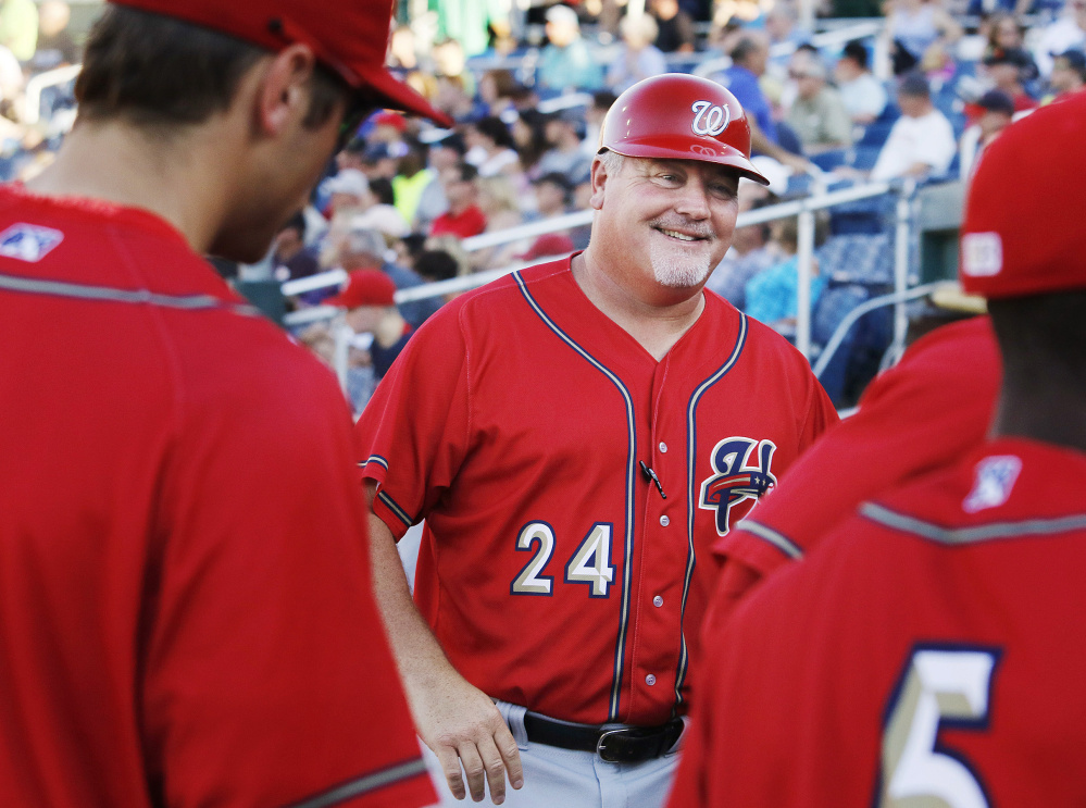 Harrisburg Senators Manager Matt LeCroy speaks to players during Saturday's game against the Portland Sea Dogs at Hadlock Field. LeCroy is in his second stint as Harrisburg manager after serving as bullpen coach for the Washington Nationals for two seasons.