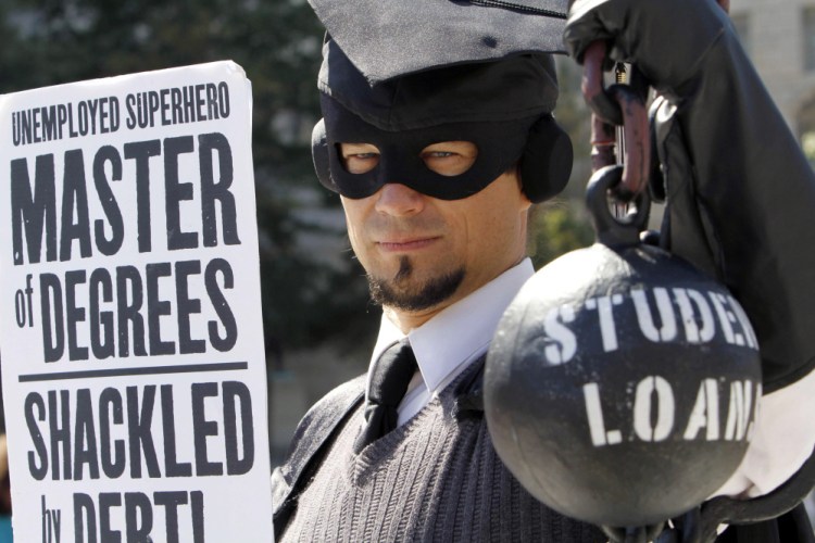 Dressed as the "Master of Degree," Gan Golan of Los Angeles holds a ball-and-chain representing his college loan debt during a 2011 protest in the nation's capital. College students in Maine graduate owing an average of $29,644 in education debt – the 14th-highest in the nation.