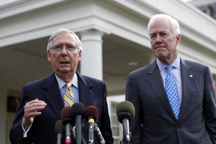 Senate Majority Leader Mitch McConnell of Kentucky, left, and Senate Majority Whip Sen. John Cornyn, R-Texas, speak with the media Tuesday as Republicans try to come up with a revised health care bill.
