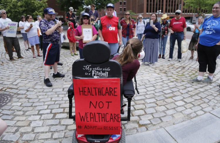 By slashing Medicaid, the Senate ACA overhaul would keep people with disabilities from living independently, says Kingsley Floyd, center. The cuts are a factor in Maine Sen. Susan Collins' opposition to the bill.