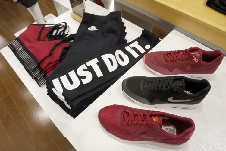 Nike products appear on display at the SIX:02 shop inside Foot Locker's redesigned Manhattan flagship store in New York. Nike says it's working on a test program to sell some of its sneakers through e-commerce giant Amazon.