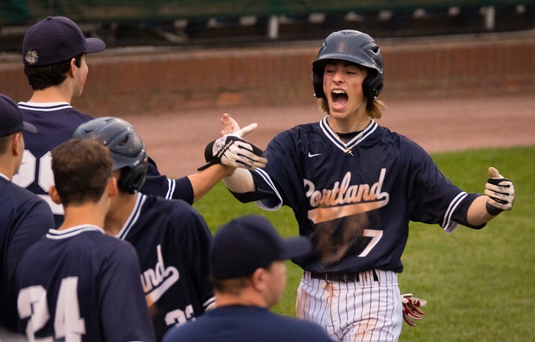 Portland’s Cam King celebrates after scoring on Dom Tocci’s  three-run triple during the 5th inning.