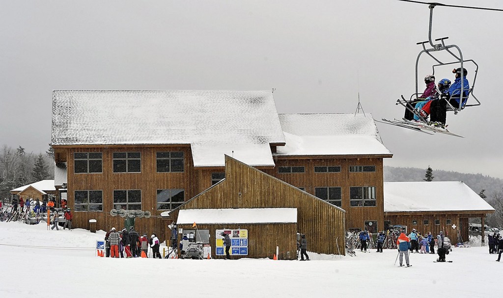Skiers ride the South Branch chairlift at Saddleback in December 2012. The ski area's need for a new chairlift to the summit was originally cited as the reason for its shutdown in 2015.