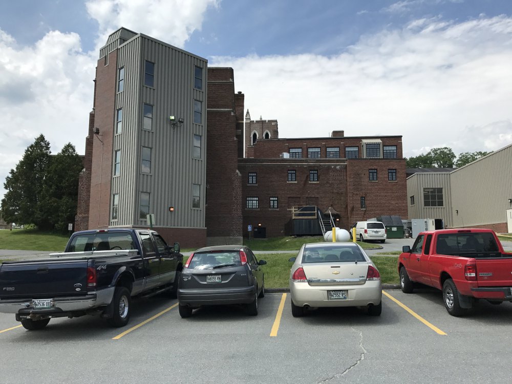 The Maine Criminal Justice Academy in Vassalboro is seen from its rear parking lot, where authorities said an accidental shooting happened Monday night that left a county corrections officer with a serious gunshot wound to the leg.