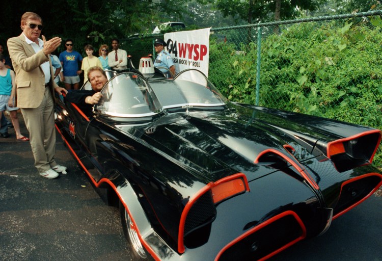 Adam West, left, stands beside the old Batmobile driven by owner Scott Chinery in Philadelphia in 1989.
