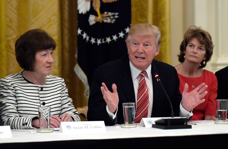President Trump, seen at a meeting last year with Susan Collins and other Republican senators, has told Collins that he wants tens of billions of dollars in the federal spending bill to subsidize health insurance.