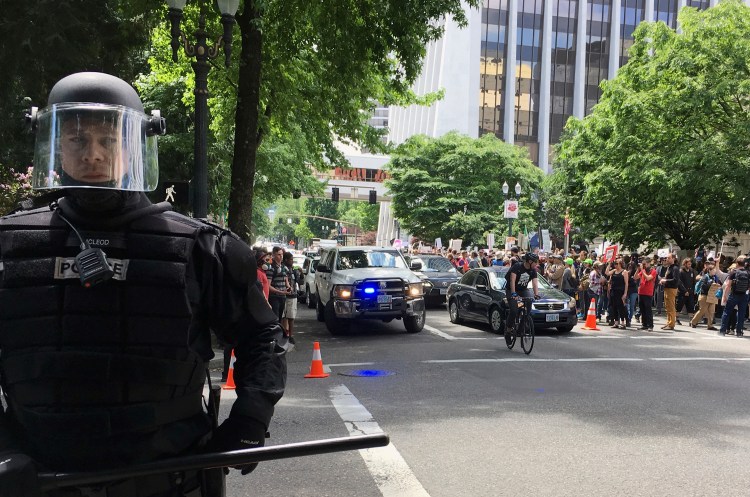 Thousands of protesters gather in Portland, Ore., for competing rallies on June 4 after the fatal stabbing of two men on a train by a man police say was shouting anti-Muslim slurs. Marches against Islamic law are scheduled in more than two dozen cities across the United States.
