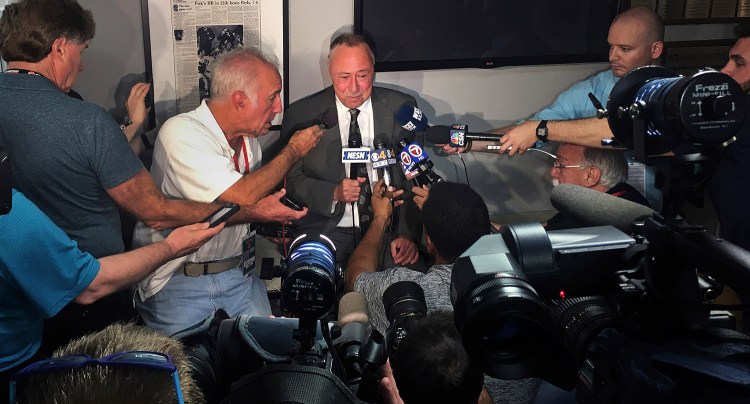 Boston Red Sox broadcaster Jerry Remy is surrounded by reporters as he announces that he has been diagnosed with cancer, prior to a baseball game at Fenway Park in Boston on Monday. Remy said he has been diagnosed with lung cancer for the fifth time and will have surgery to treat it in two weeks. 