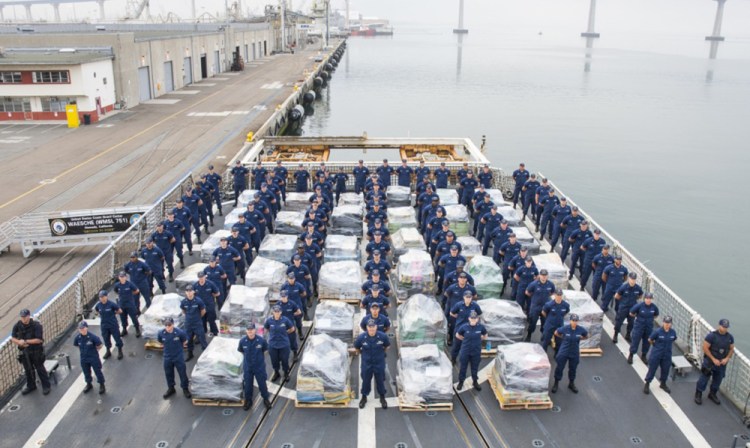 Crewmembers pose with the confiscated drugs on the deck of the Coast Guard Cutter Waesche in San Diego Thursday.