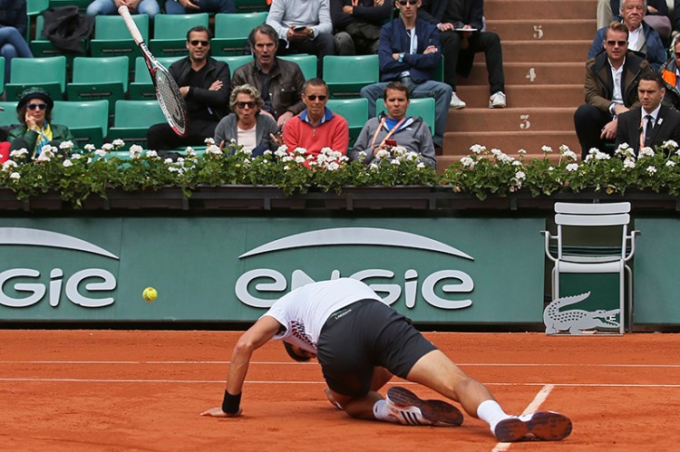 Serbia's Novak Djokovic slips in his quarterfinal match of the French Open tennis tournament against Austria's Dominic Thiem.