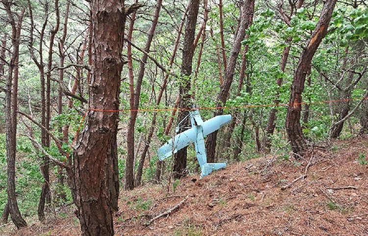 In this Friday, June 9, 2017 photo provided by South Korean Defense Ministry on Tuesday, June 13, 2017, a suspected North Korean drone is seen in a mountain in Inje, South Korea. South Korean Defense Ministry said on Tuesday, June 13, 2017, the suspected North Korean drone found near the Korean border was found to have taken photos of a U.S. missile defense shield in the South. Investigators discovered hundreds of photos from the drone's Sony-made in-built camera. (South Korean Defense Ministry via AP)