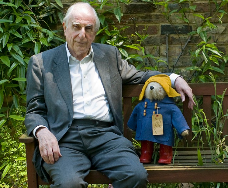 British author Michael Bond sits with a Paddington Bear toy during an interview in 2008. 