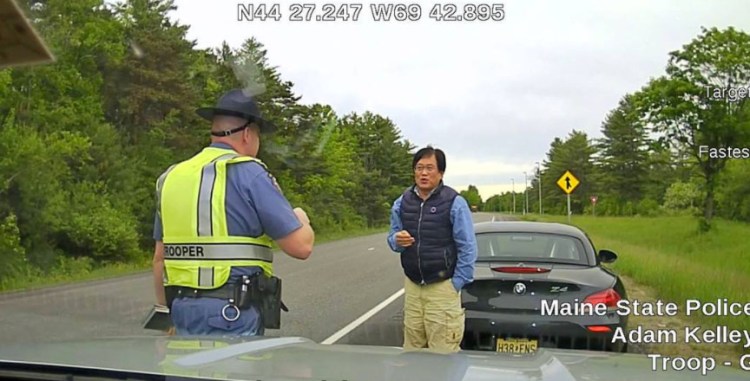 This dashcam image from Trooper Adam Kelley's cruiser shows Sang Yook, 64, who police say got out of his car to ask for a break and refused to get back in.  He was arrested for criminal speed and the 2014 BMW Z-4 was towed.  