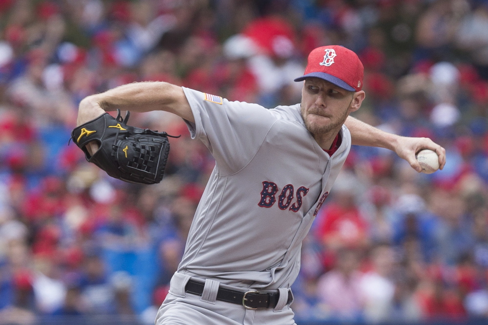 Boston Red Sox starting pitcher Chris Sale works against Toronto Blue Jays during the fourth inning Saturday in Toronto. Sale will become the first pitcher to start back-to-back All Star games representing different teams when he takes the mound Tuesday in Miami.