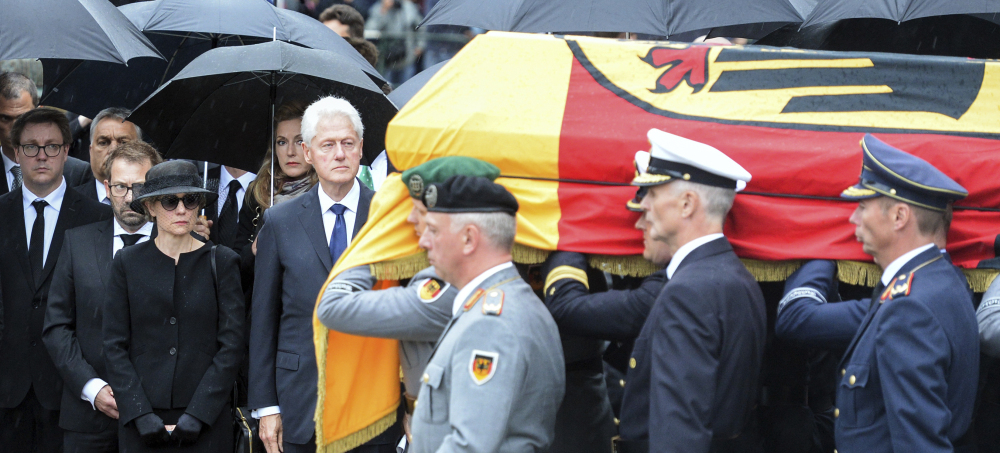 Soldiers carry the coffin of former German chancellor Helmut Kohl in Speyer, Germany, on Saturday. Watching at the side is Kohl's widow Maike Kohl-Richter, left, and former President Bill Clinton. Kohl died June 16 at 87.