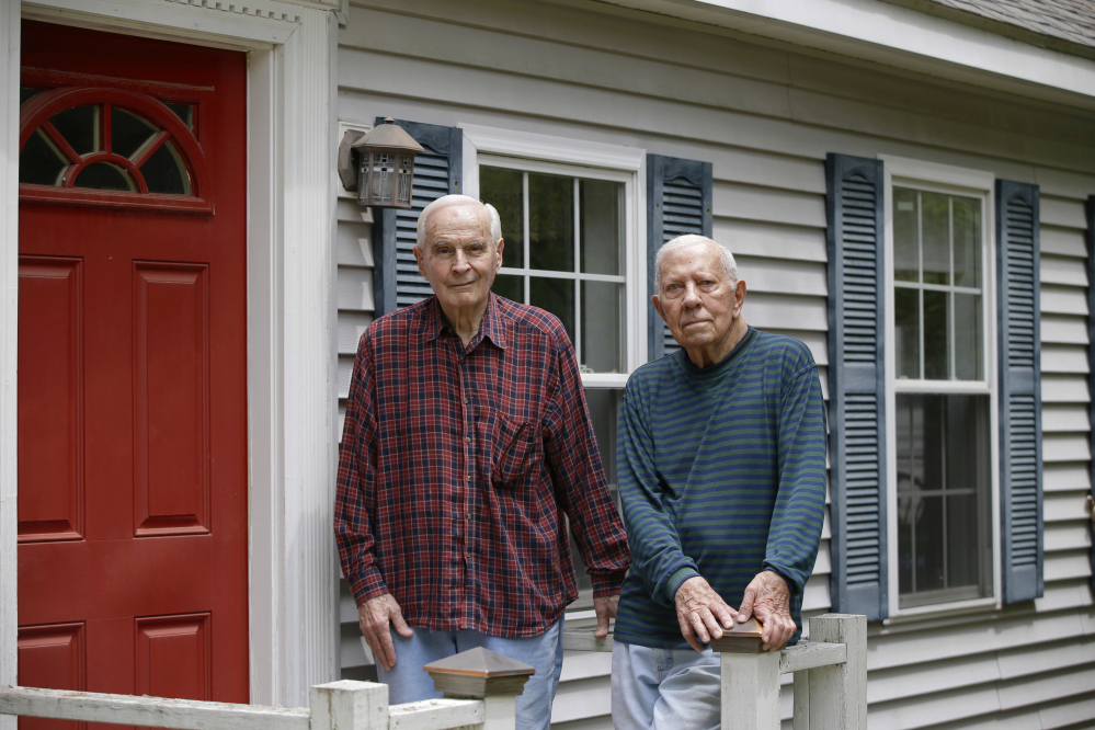 Richard Perkins, right, and Robert Maurais stand outside their home in Ogunquit. Politicians have been chipping away at funding for heating aid to low-income Americans for a decade. Now President Trump has proposed ending it altogether, eliciting an outcry from low-income residents who depend on the program to stay warm. Perkins called the proposed elimination of heating aid "cruel."