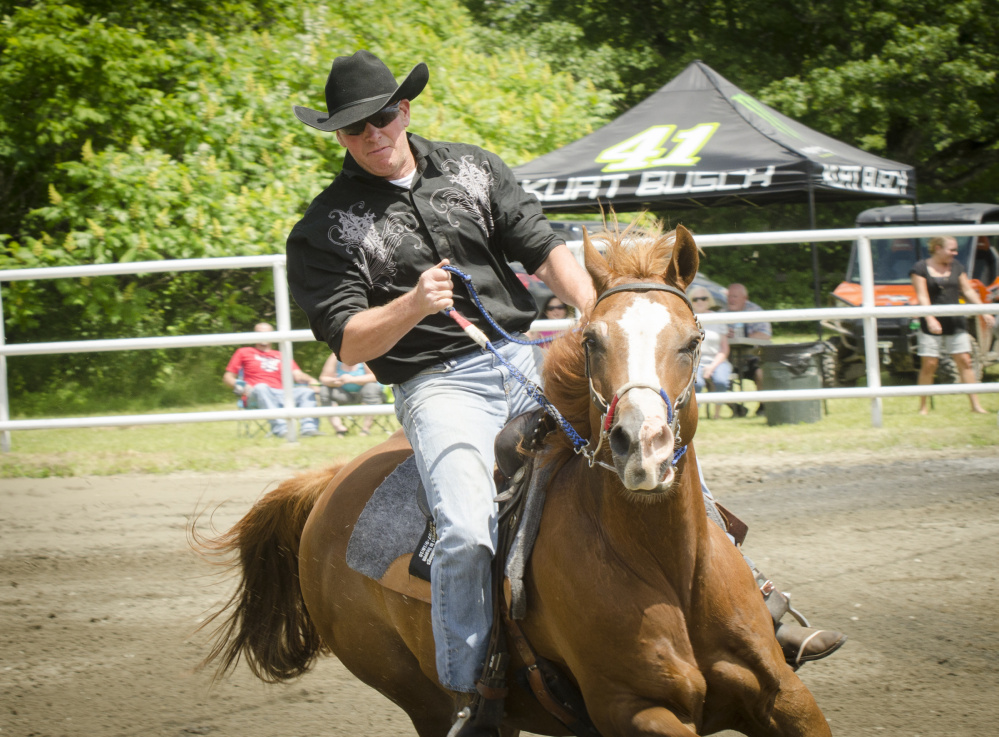 Hardy Cummings rides his horse at the Halee Lynn Cummings Memorial Barrel Race at the Silver Spur Riding Club in Sidney on Sunday to honor his late daughter.