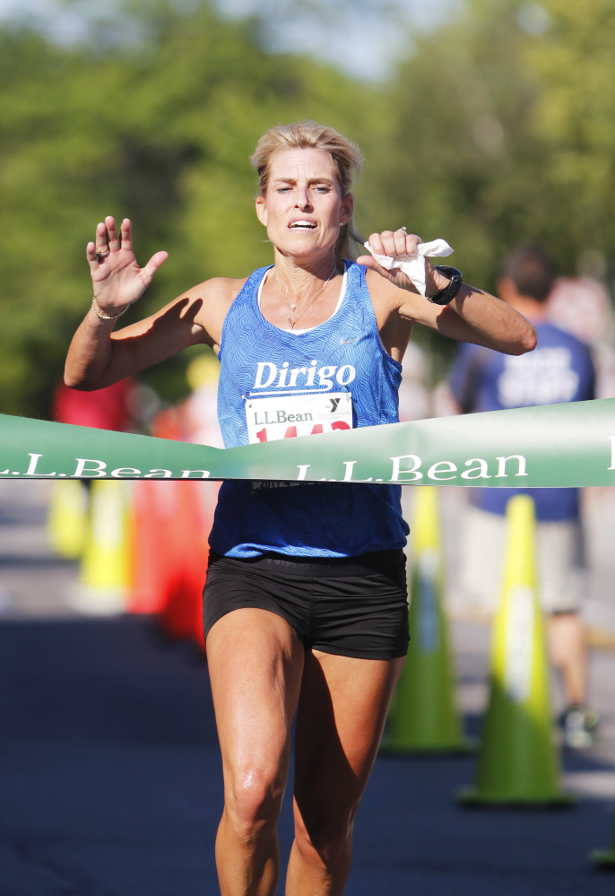 Sheri Piers of Falmouth is the first women's finisher in the L.L. Bean Fourth of July 10K on Tuesday in Freeport. Piers finished in 37:54.