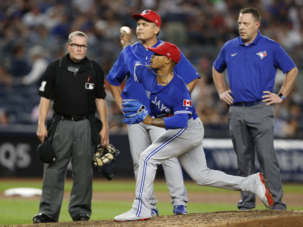 Blue Jays righty Marcus Stroman, center, was removed from his start against the Yankees after 79 pitches Monday because of a developing blister, a common injury this season.