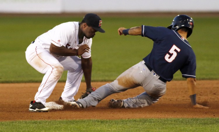 Sea Dogs infielder Josh Tobias tags out New Hampshire's Tim Lopez in Wednesday night's game at Hadlock Field.