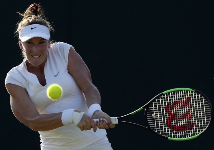 Madison Brengle of the United States returns against Petra Kvitova during their second-round match Wednesday at the All England Club. Brengle, ranked 95th in the world, pulled a 6-3, 1-6, 6-2 upset of the two-time Wimbledon winner.