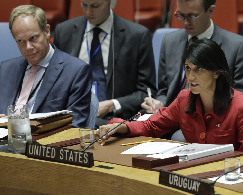 United Kingdom U.N. Ambassador Matthew Rycroft, left, listens as United States U.N. Ambassador Nikki Haley responds harshly to Russia's statements, during the U.N. Security Council meeting Wednesday.