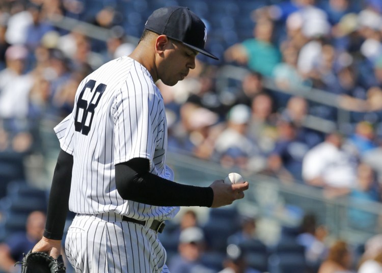 Yankees relief pitcher Dellin Betances has his head down after loading the bases in the eighth inning against Toronto on Wednesday. He went on to walk in the go-ahead run in a 7-6 loss.