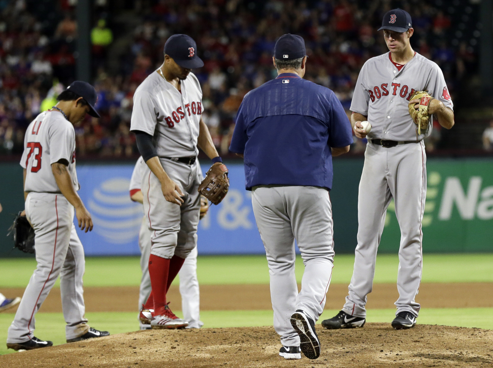 Red Sox manager John Farrell walks up to take the ball from starting pitcher Doug Fister in the fourth inning of Wednesday night's game.