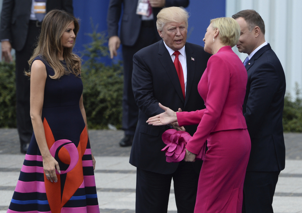 President Trump endures an awkward moment Thursday in Warsaw as Poland's first lady Agata Kornhauser-Duda reaches to shake hands with first lady Melania Trump.